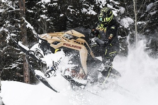 a man flying through the air while riding skis